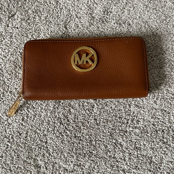 Michael Kors Handbags - Michael Kors Brown pebble leather Wallet with Gold Logo and hardware